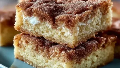 Chewy snickerdoodle cookie bars topped with cinnamon sugar