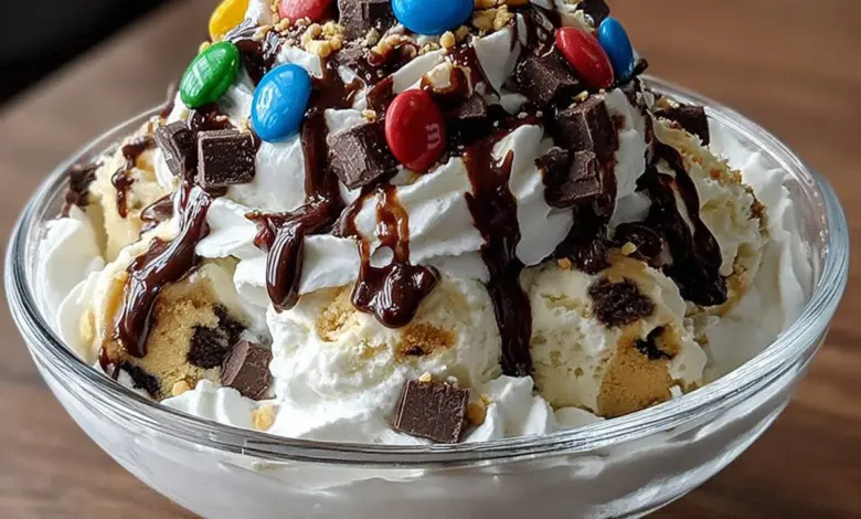 Delicious Chocolate Crunch Cookie Dough Sundae topped with cookie dough and chocolate crunch