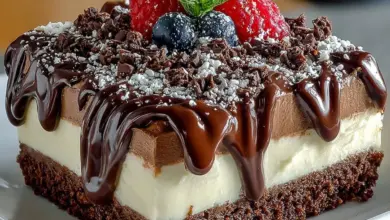 Delicious chocolate mousse dessert topped with chocolate shavings and berries.