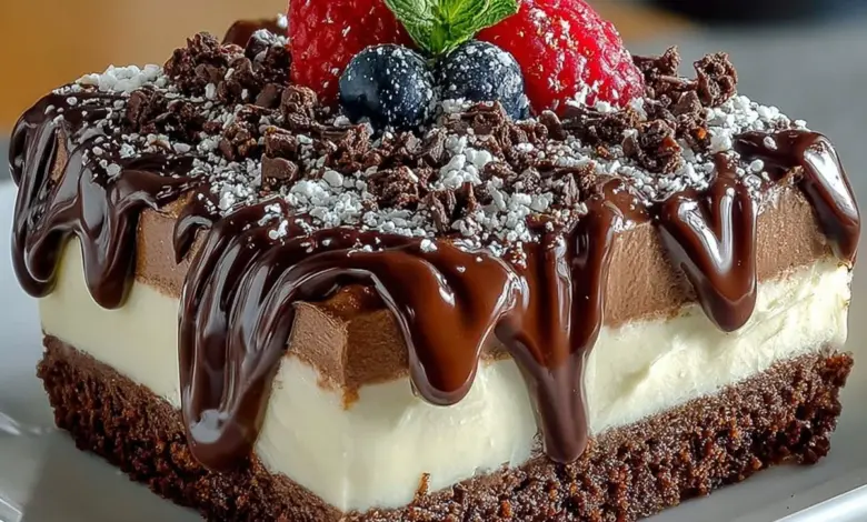 Delicious chocolate mousse dessert topped with chocolate shavings and berries.