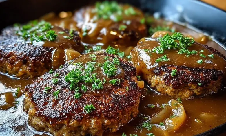 Plate of delicious Salisbury steak served with gravy and vegetables