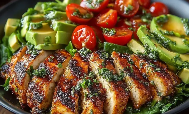 Grilled chicken avocado salad with fresh greens and vegetables