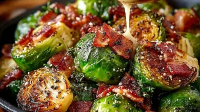 Honey-glazed roasted Brussels sprouts with crispy bacon in a serving dish