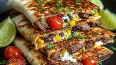 Delicious loaded steak quesadillas with melted cheese and toppings