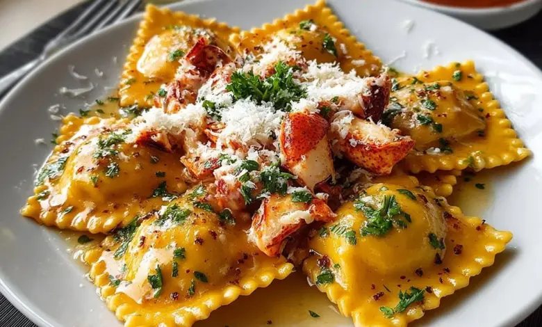 Plate of Lobster Ravioli garnished with herbs and sauce