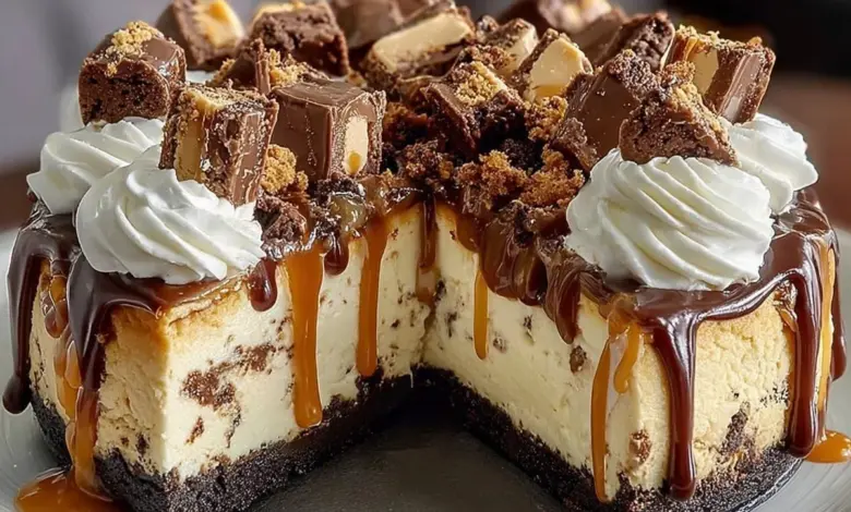 Delicious Reese's Peanut Butter Cup Cheesecake topped with chocolate and peanut butter.