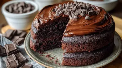 Delicious triple chocolate cake topped with chocolate frosting and shavings