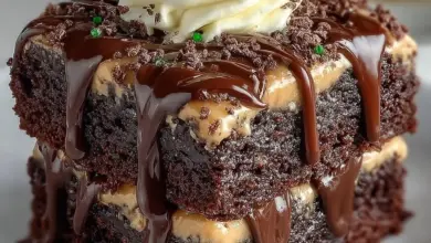 Delicious Baileys Irish Cream brownies on a plate, garnished with chocolate shavings.