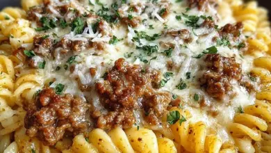 Beef Rotini in creamy garlic parmesan sauce served on a plate