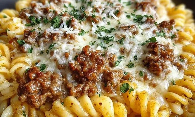 Beef Rotini in creamy garlic parmesan sauce served on a plate