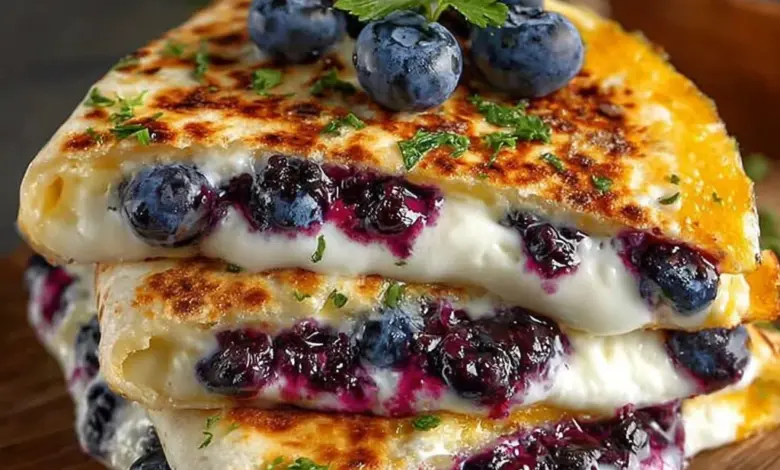 Blueberry breakfast quesadillas with melted cheese and fresh berries