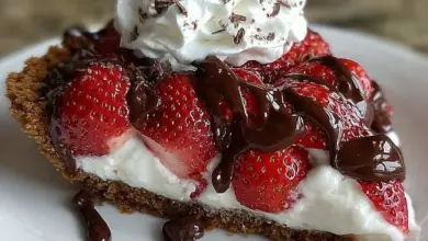 Delicious chocolate covered strawberry pie with fresh strawberries and chocolate drizzle
