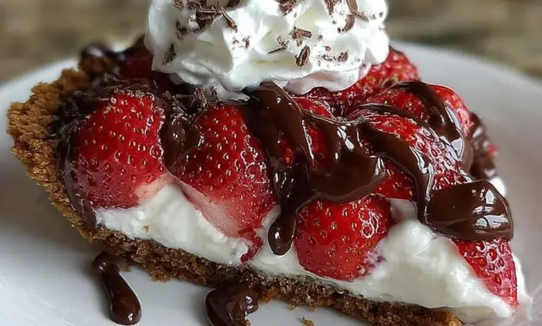 Delicious chocolate covered strawberry pie with fresh strawberries and chocolate drizzle