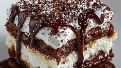 Decadent brownie lasagna dessert with layers of chocolate and cream