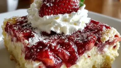 Delicious Donna Wood strawberry cheesecake dump cake sliced and served.