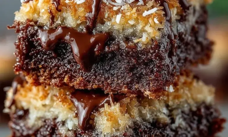 Rich German chocolate brownies with a coconut pecan topping on a plate.
