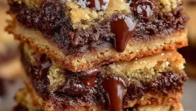 Gooey chocolate chip cookie bars on a cooling rack