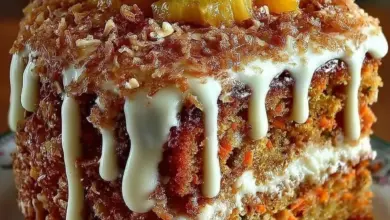 Hawaiian Carrot Pineapple Cake topped with cream cheese frosting and garnished with pineapple.