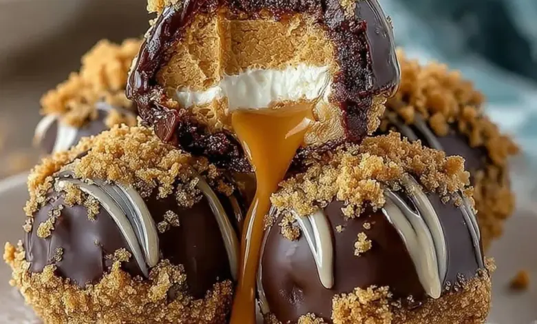 No-bake peanut butter cheesecake balls on a plate, drizzled with chocolate.