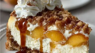 Delicious Peach Cobbler Cheesecake with fresh peaches and a buttery crust.