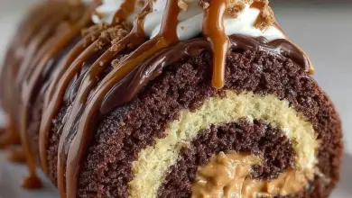 Peanut Butter Cup Chocolate Roll Cake with creamy peanut butter filling