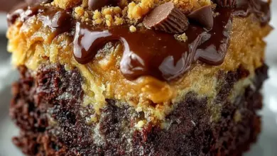 Delicious Peanut Butter Cup Dump Cake topped with chocolate and peanut butter.