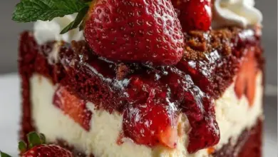 Delicious Red Velvet Strawberry Cheesecake served on a plate