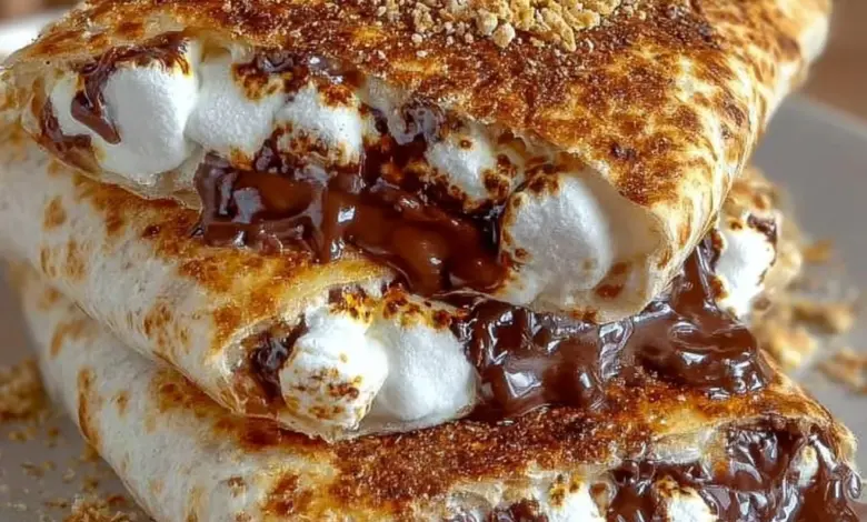 Delicious S'Mores Crunchwrap featuring chocolate, marshmallows, and graham crackers.