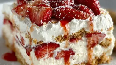 Delicious Strawberry Cream Cheese Icebox Cake topped with fresh strawberries