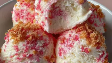 Bowl of strawberry crunch ice cream with crispy topping