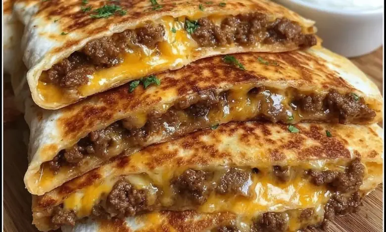Bacon cheeseburger quesadillas on a plate, garnished and ready to serve.