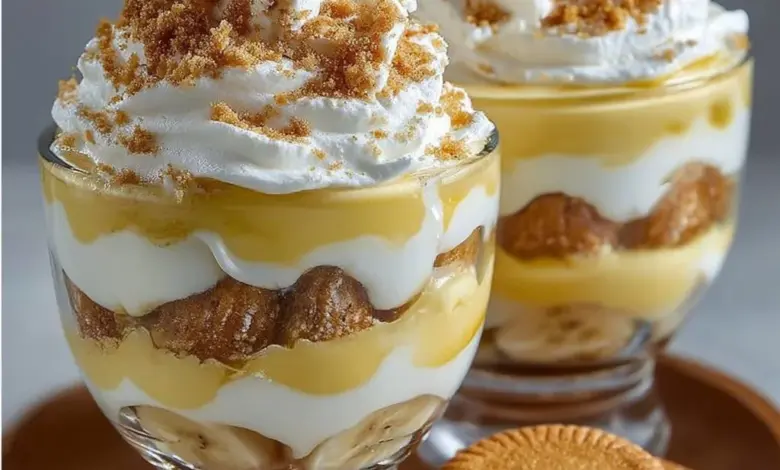 Delicious banana pudding cups topped with whipped cream and banana slices