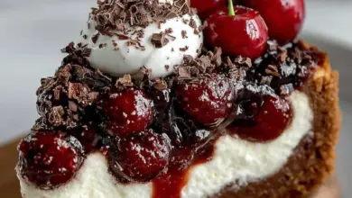 Delicious Black Forest Cheesecake topped with cherries and chocolate shavings