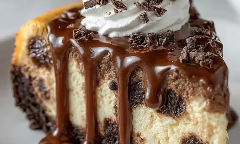 Delicious Boston chocolate cream pie cheesecake topped with chocolate drizzle.