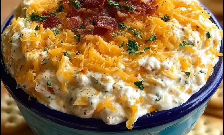 Delicious Cheddar Ranch Party Dip served in a bowl with vegetables and chips