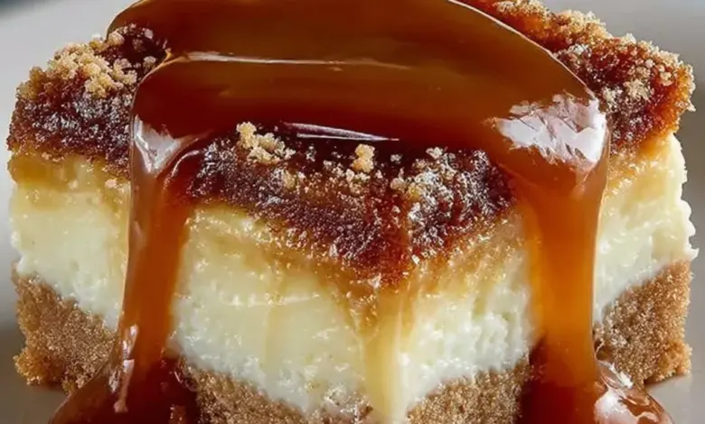 Creamy caramel cheesecake bars topped with a rich caramel drizzle.