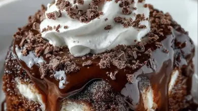 Death by Chocolate Poke Cake topped with chocolate frosting and ganache