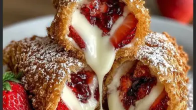 Delicious deep fried strawberry cheesecake pies served on a plate