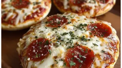 Delicious English muffin pizzas topped with cheese and vegetables