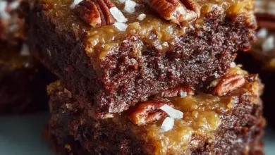 Delicious homemade German chocolate pecan brownies on a wooden table
