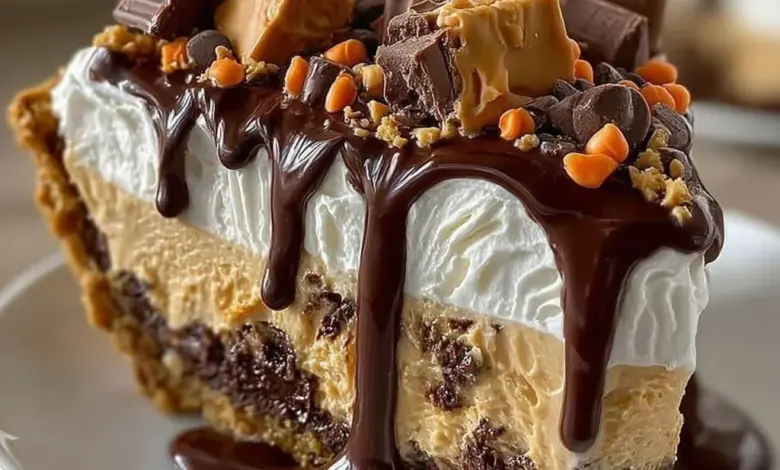 Giant Reese's Peanut Butter Cup Pie served on a plate with chocolate drizzle