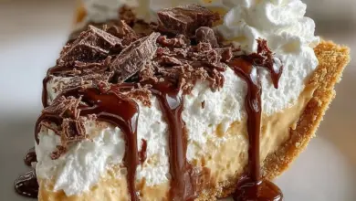 Slice of Old-Fashioned Amish Peanut Butter Dream Pie on a plate