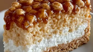 Delicious Rice Krispie Treat Cheesecake topped with festive sprinkles