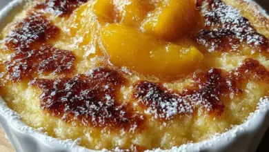 Delicious Tennessee Peach Pudding served in a bowl with fresh peaches